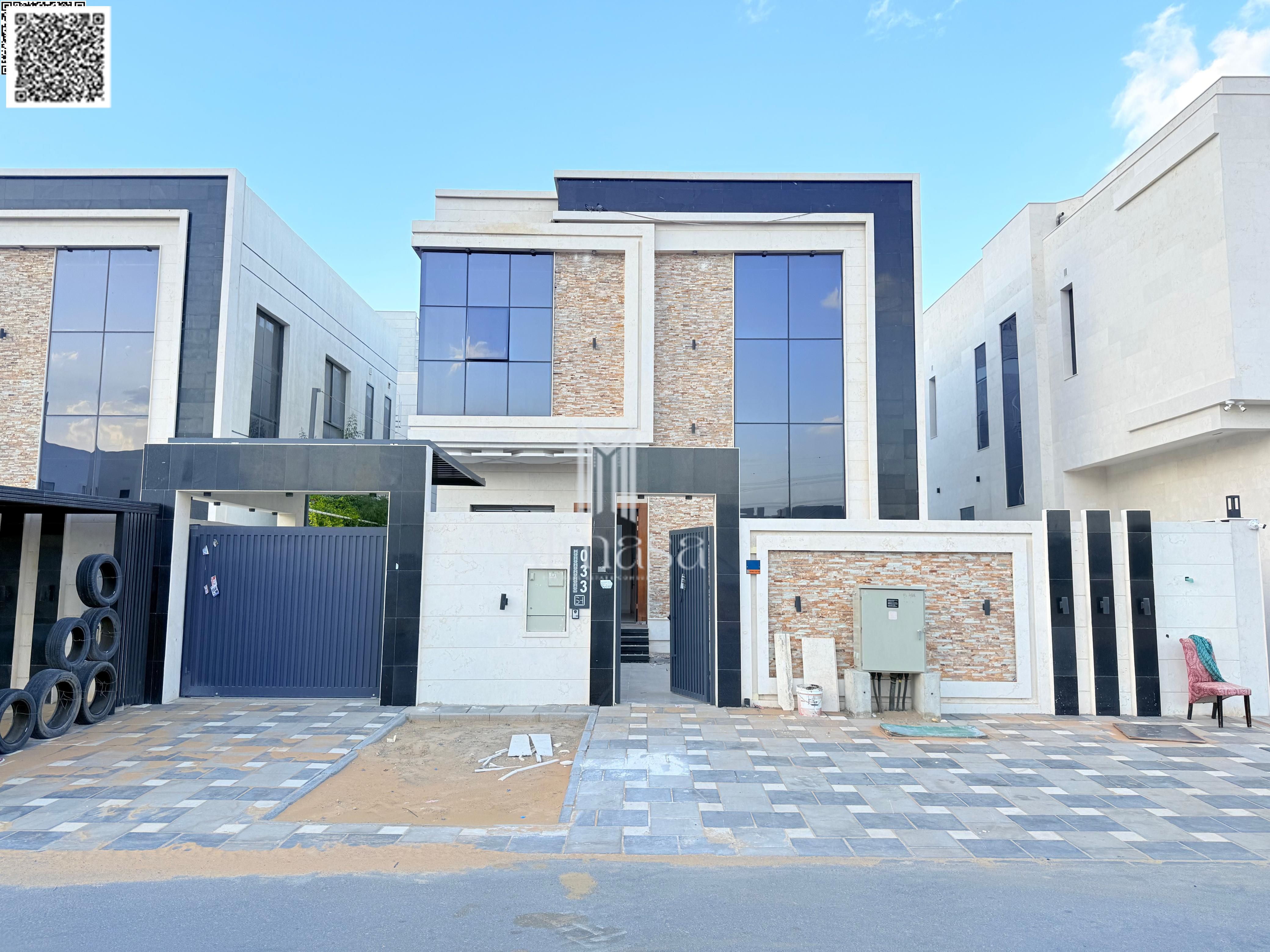 Luxury villa with a swimming pool and excellent finishes in the Al Yasmin area, directly next to Al Hamidiya Park - freehold ownership for all nationa
