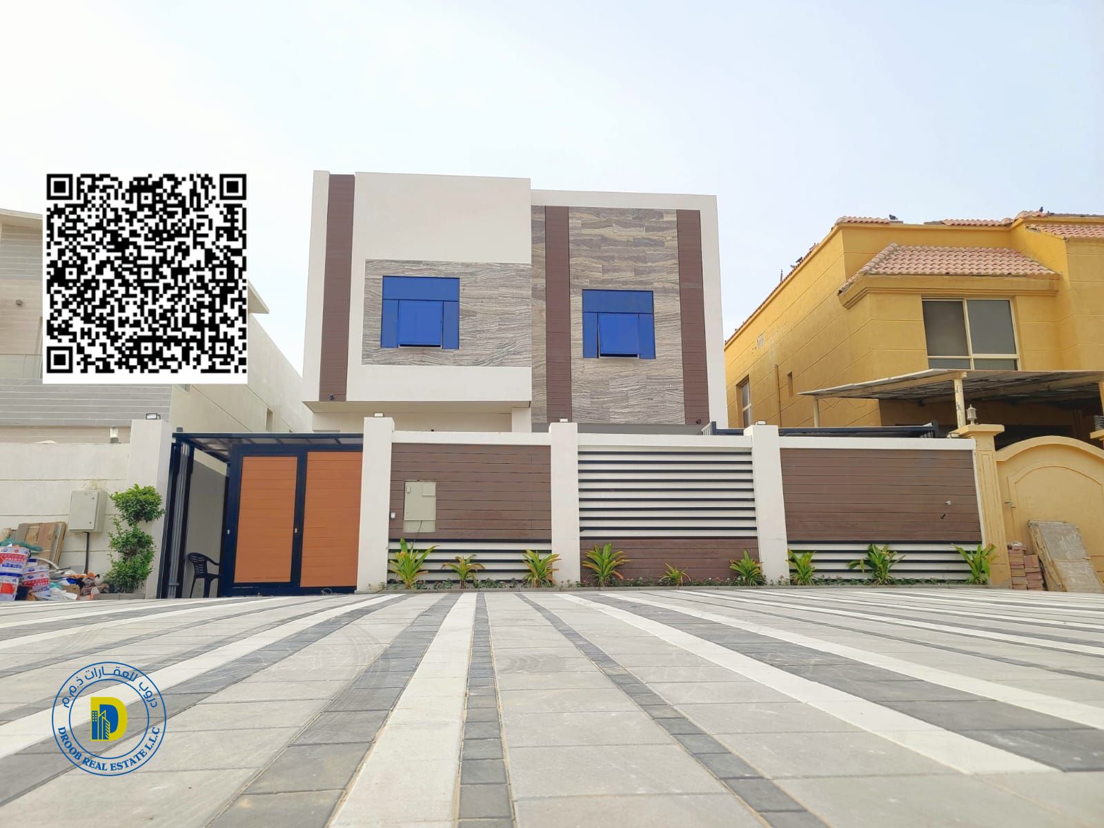 For those seeking luxury, a 6-bedroom villa in Al Muwaihat 1, including electricity, water, and AC, bank financing, freehold .