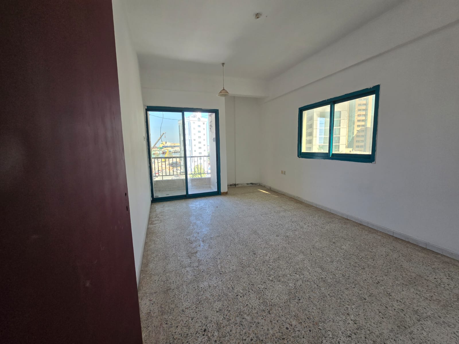One-bedroom apartment with living room and balcony in Al Qasimia Al Jubail, open sea view, first row Corniche, rent 28,000 AED.