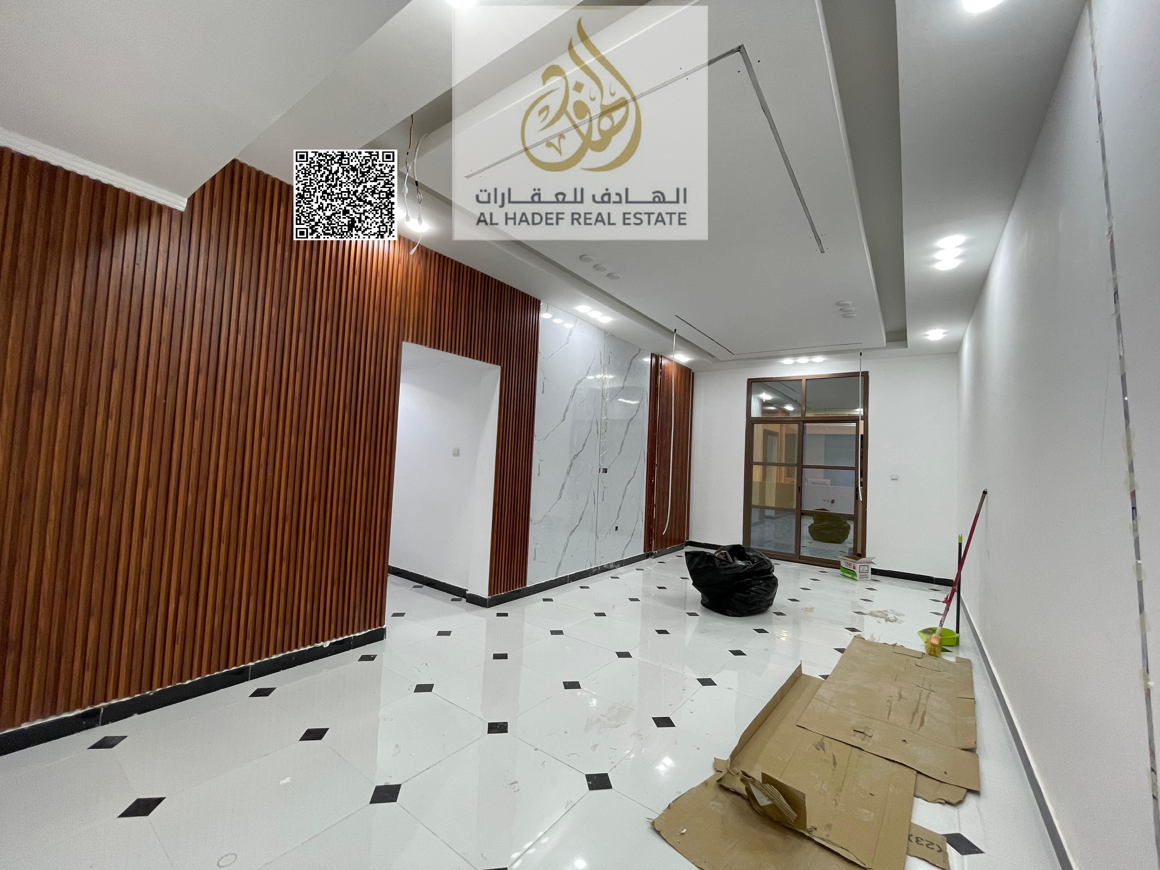 Two bedrooms and a living room in Rawda 3 Near Khartoum Street Near Dubai and Sharjah exit Super deluxe finishing Payments in 4 installments Security