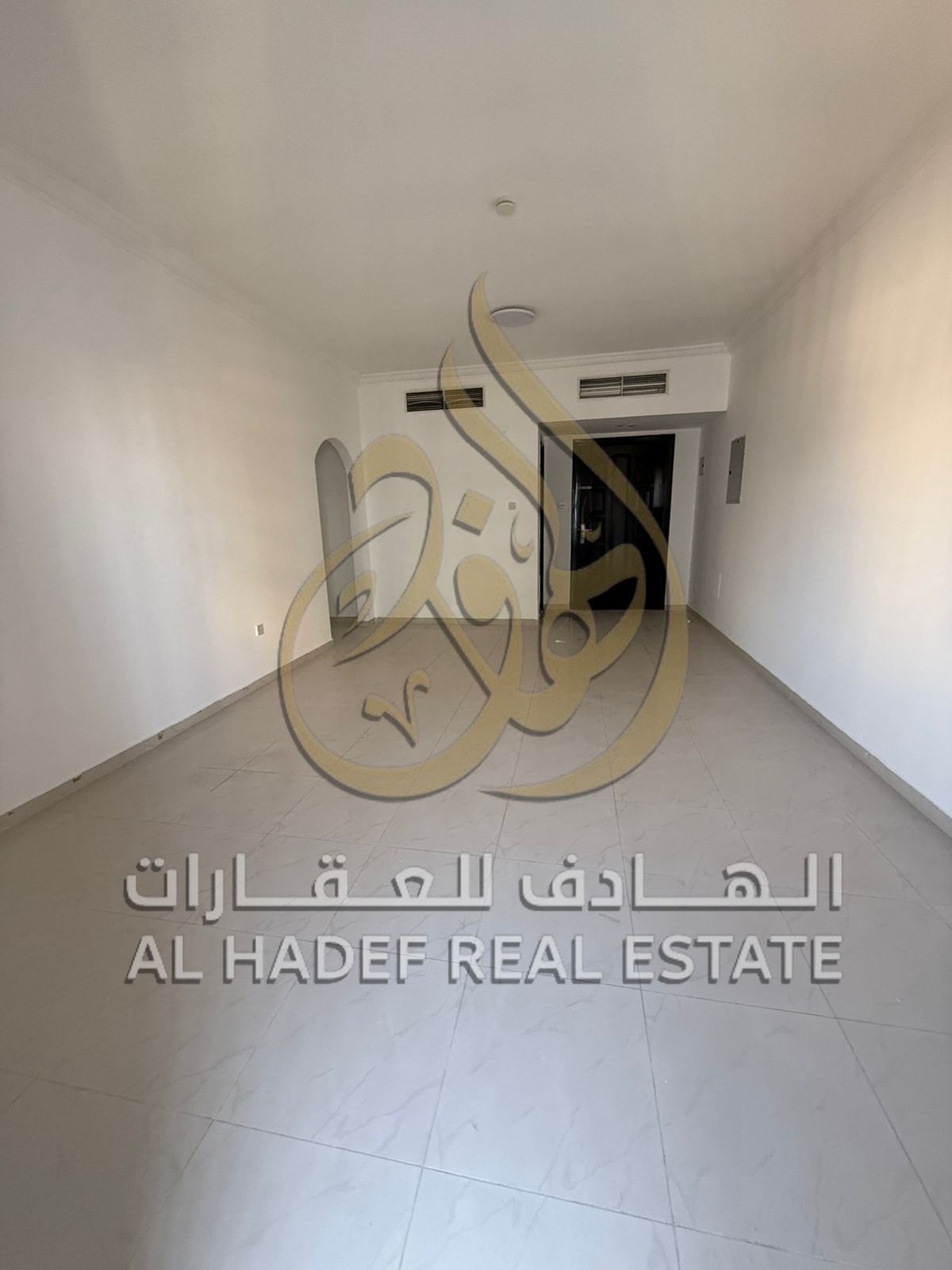 Two bedrooms and a living room for annual rent, plus a maid's room in Al Qasba with a balcony and lake view. Free parking, free maintenance, 4 or 6 in