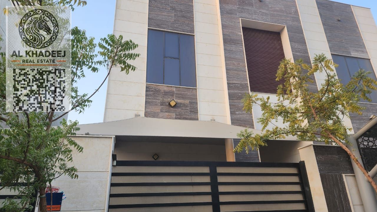 A villa in the heart of Al Yasmin district, Ajman, featuring spacious living areas, a modern design, and luxurious finishes near Al Hamidiya Park.