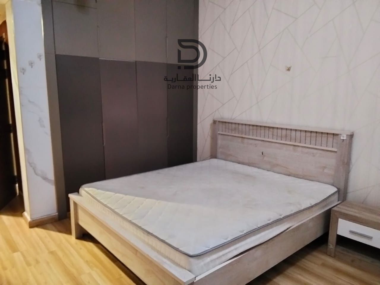 Own a two-bedroom apartment with living room in Al Waha, featuring an open view toward Al Khor Towers, prime location close to all essential services