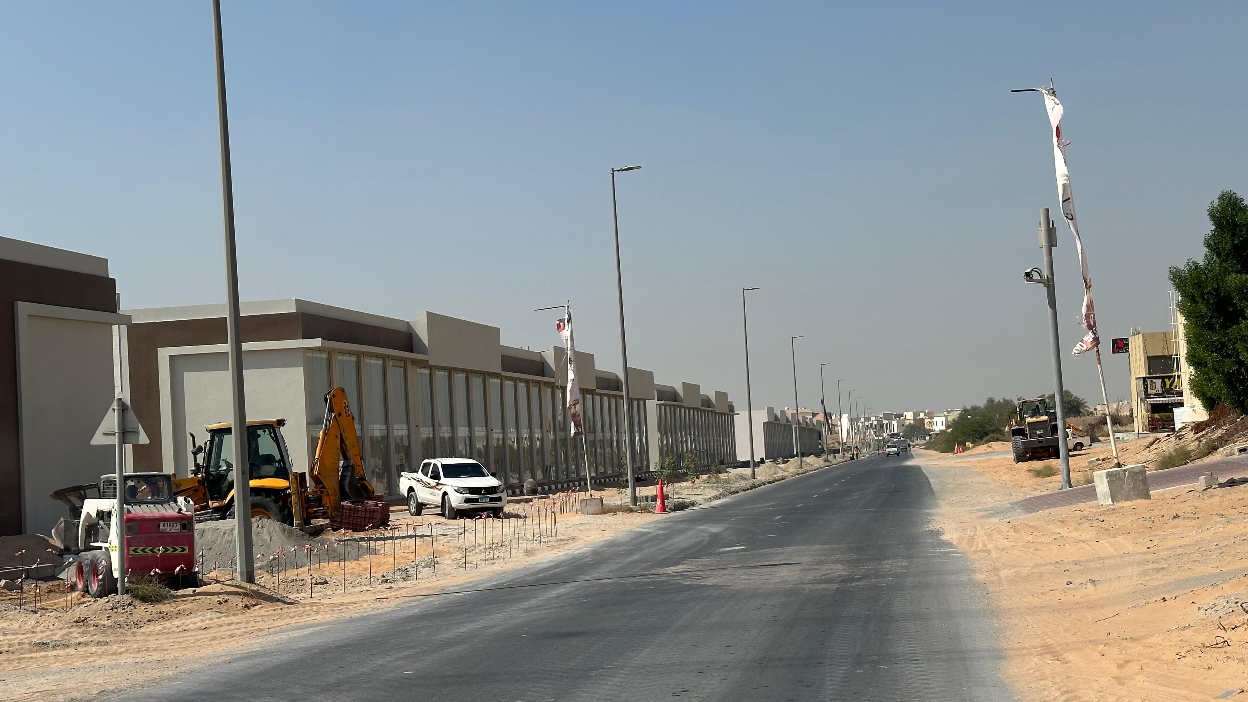 Commercial building in Al-Helio -4 shops- including fees & registration