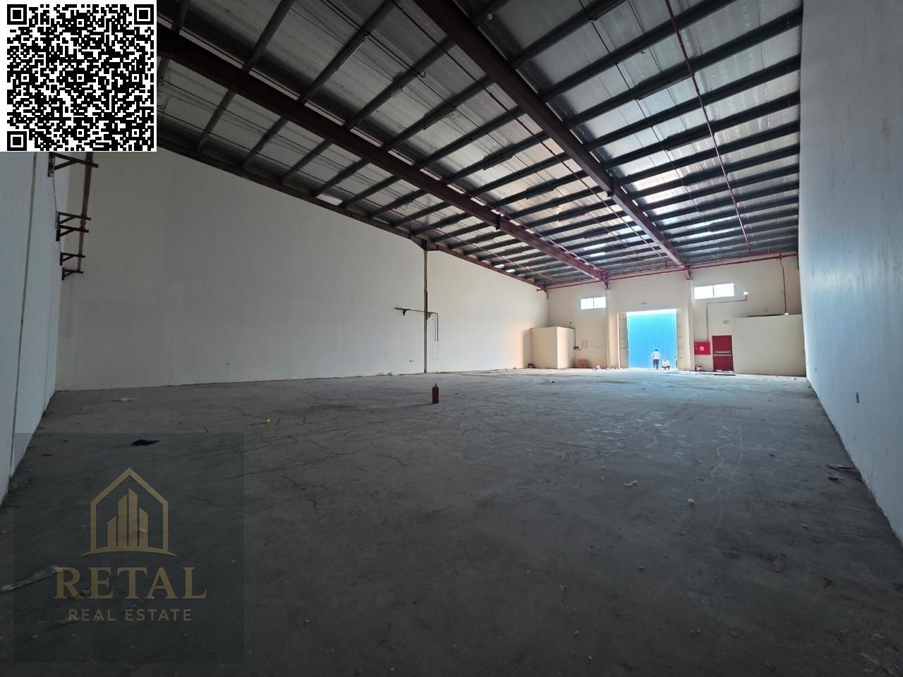 Large warehouse for rent near the main street, suitable for all activities.