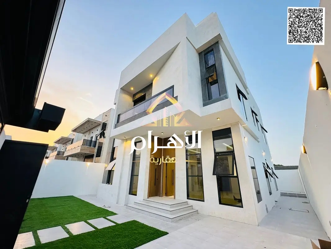 Luxury villa for sale in Al Zahia, Ajman, including registration and ownership fees. Located on a main street, it features 5 bedrooms, a living room,