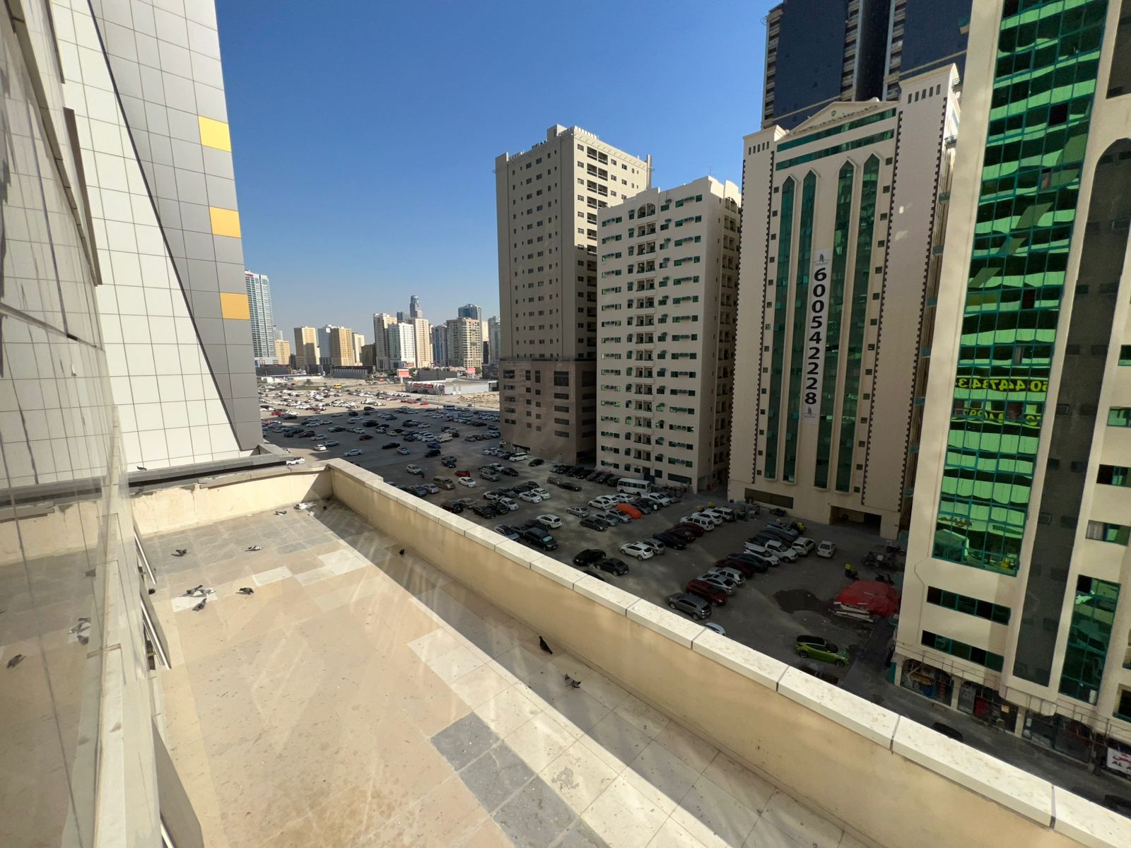 One-bedroom apartment with living room in Al Taawun. Open view, gym and pool, close to Dubai exit. Rent AED 39,000.