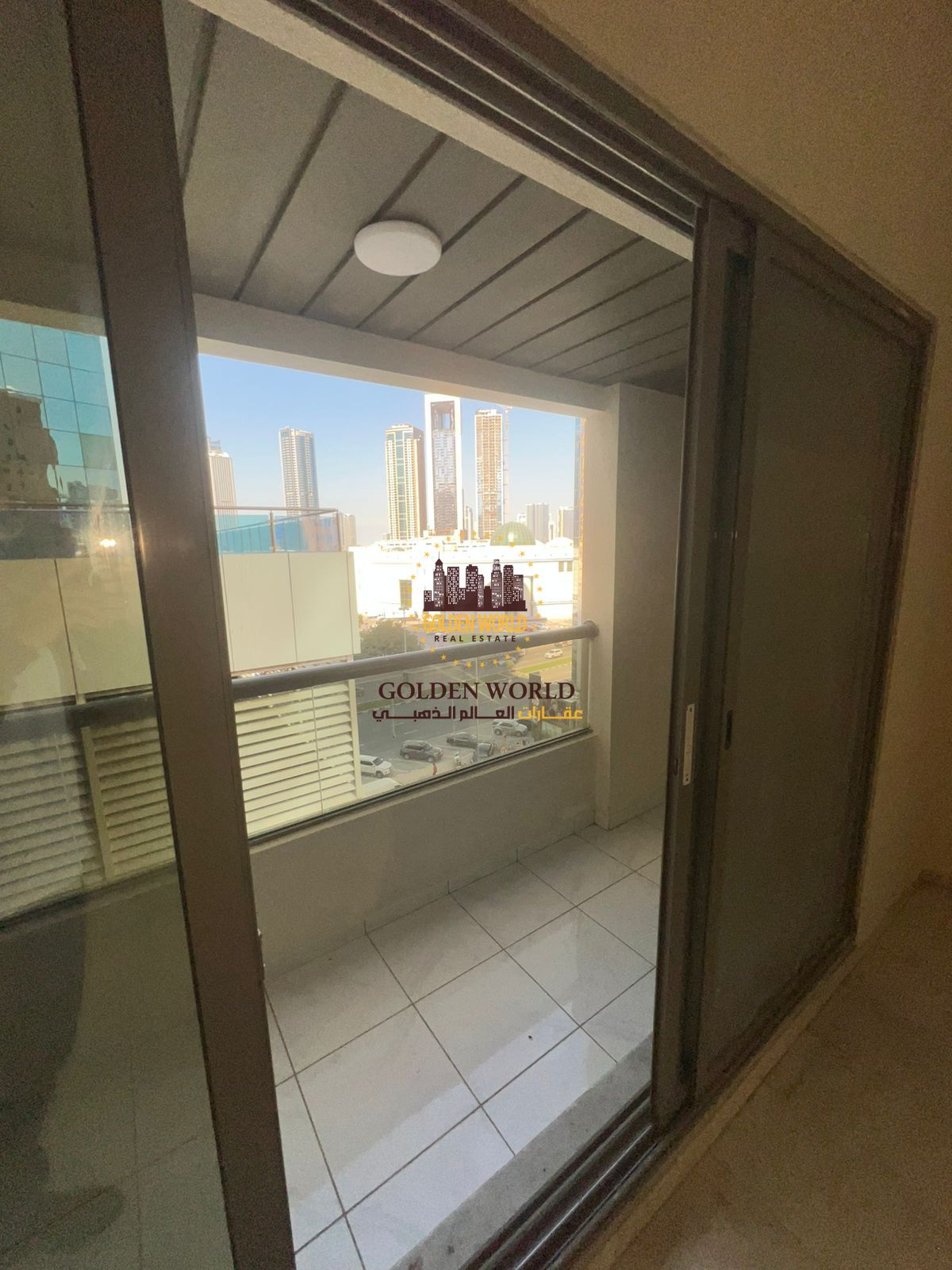 2BR apartment with balcony in Al Taawun, built-in wardrobes, master bedroom, 2 bathrooms, open view, prime location, payable in 4 cheques.