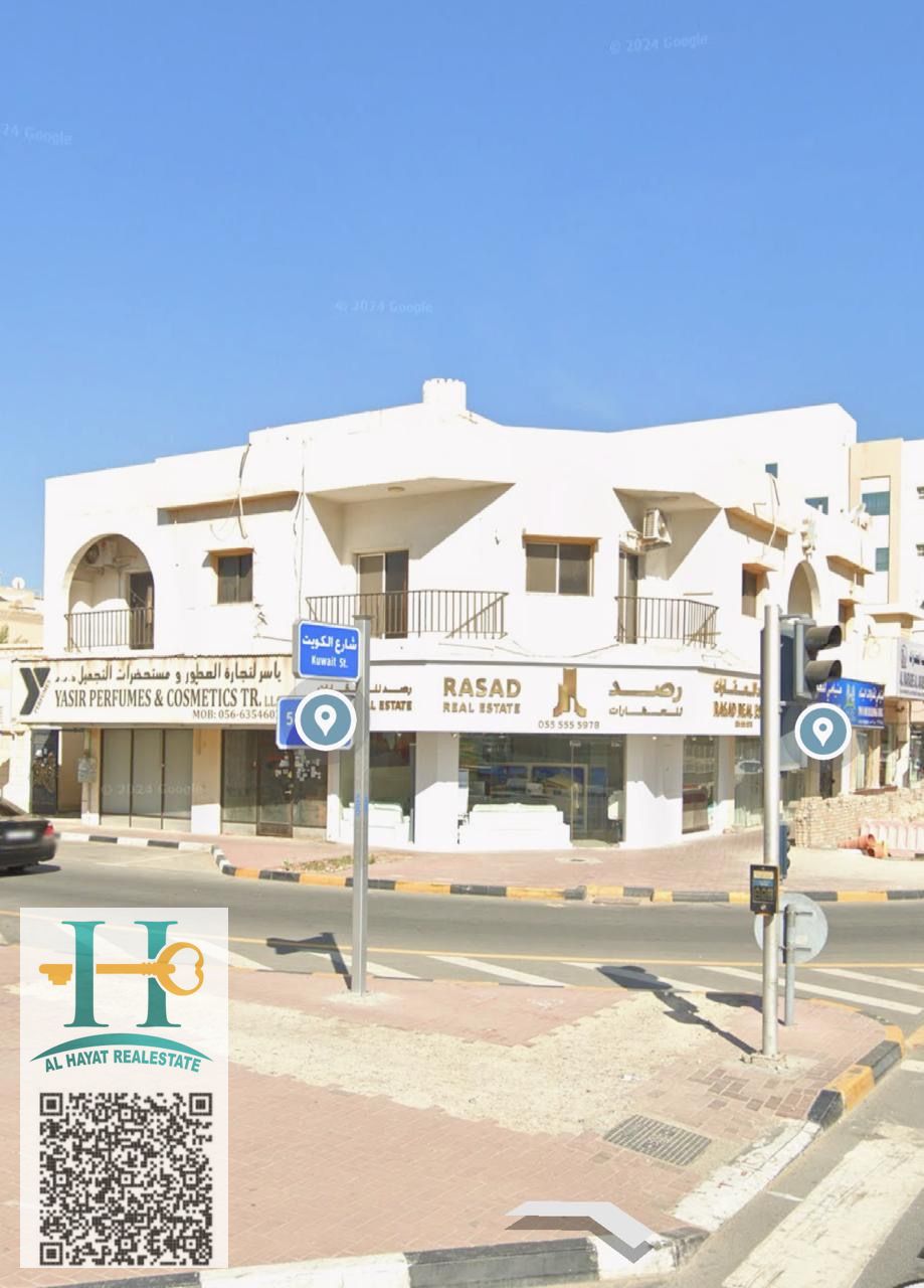 Ground and first floor building for sale on Kuwait Street, corner lot. Area: 3000 sq ft. Consists of: 6 shops, 2 three-bedroom apartments, 1 studio. Income: AED 230,000. Asking price: AED 3,500,000.