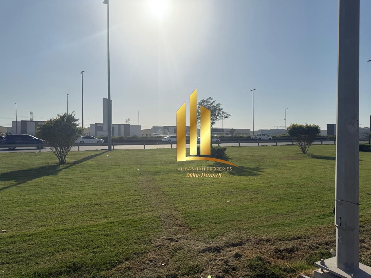 Corner commercial plot for sale in Al-Hawshi, Al-Badi'a suburb, Sharjah. Freehold ownership for Arab nationals.