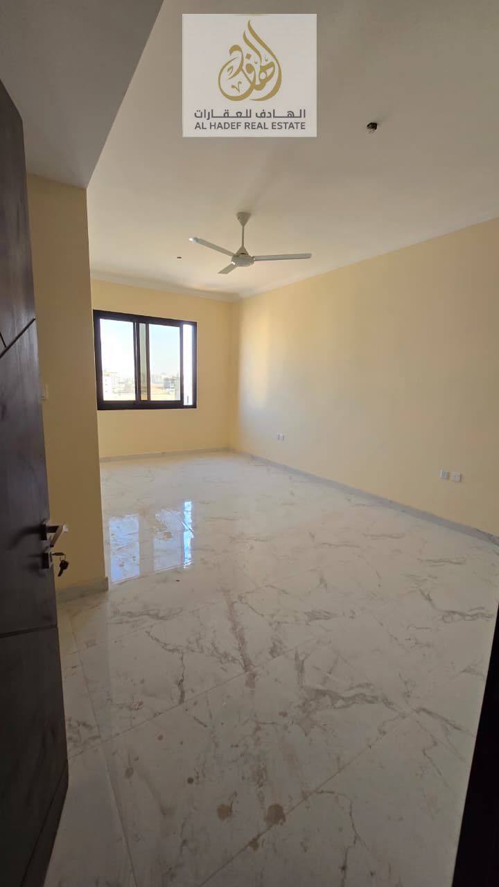 One bedroom, living room, and two bathrooms. First occupancy. Close to the Dubai and Sharjah exit. Excellent location, very spacious, and open view.