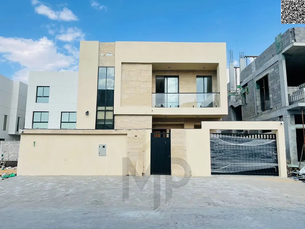 Luxury villa in Al Yasmin, Ajman, directly behind the mosque, with two floors and a roof, ready for immediate occupancy with high-end finishes, price