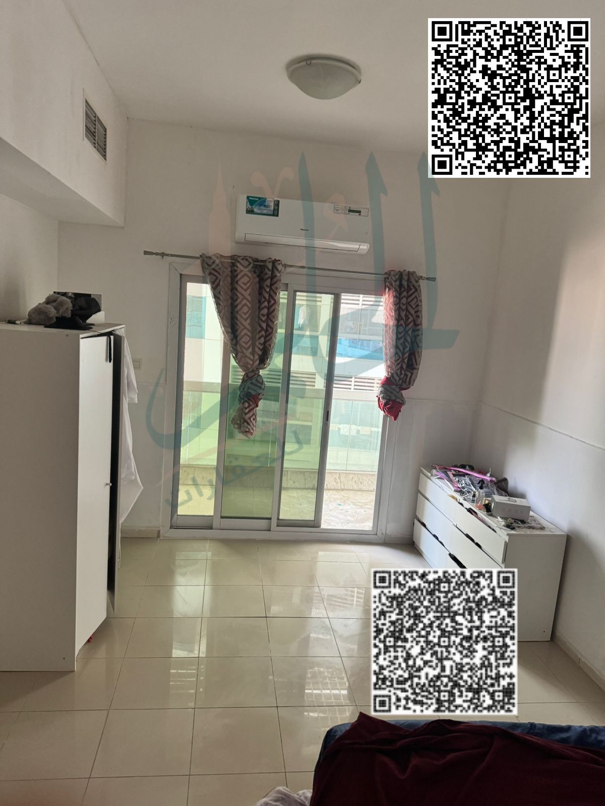 One bedroom and living room for sale in Lulu Towers Ajman complex with an open view, ideal for real estate investors in Ajman, with private parking at