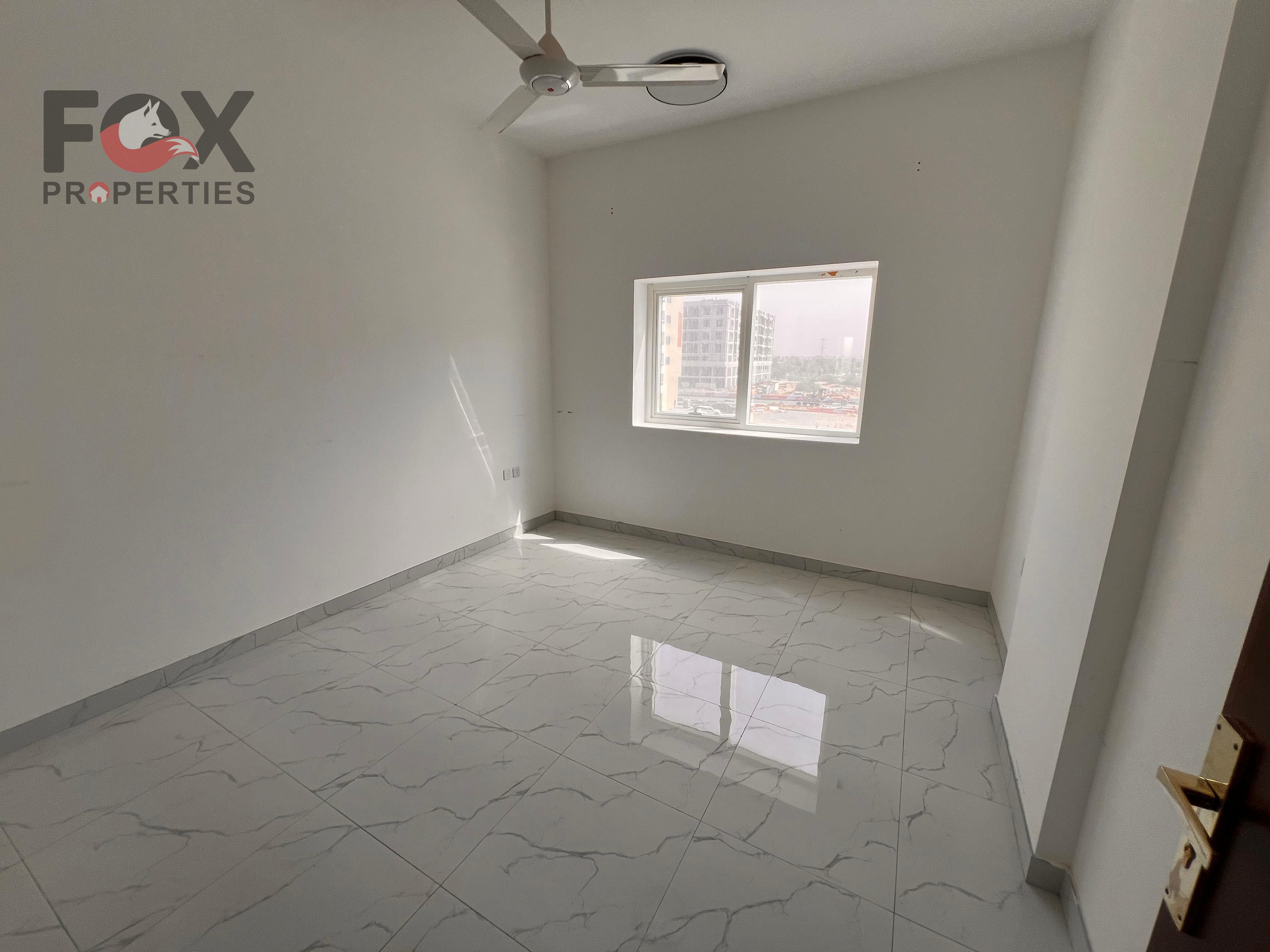 Two-bedroom apartment with a living room for annual rent in Al Muwaihat. Two bathrooms, excellent size, and a balcony.