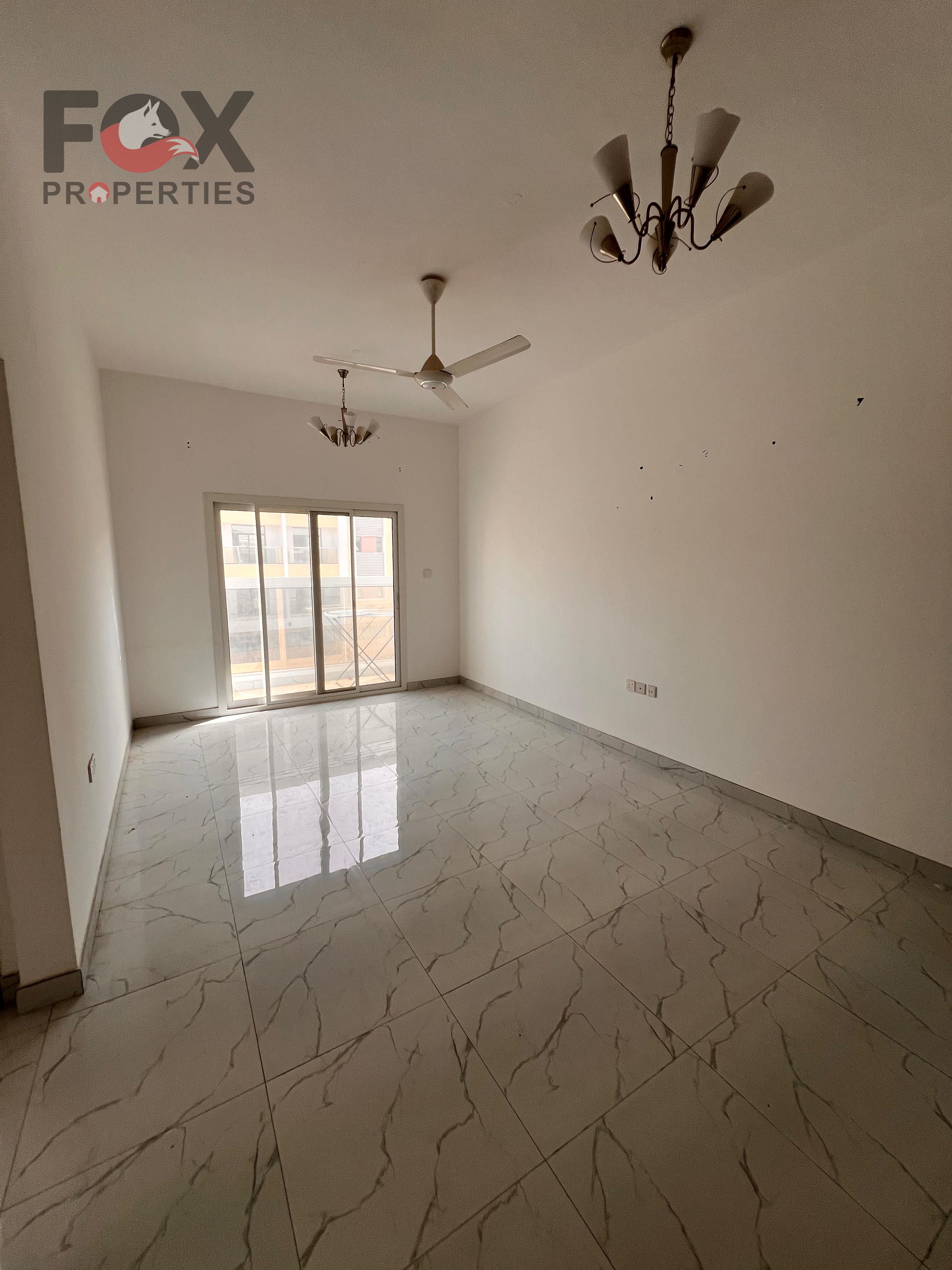 Two bedrooms and a living room for rent in a prime location near Mohammed Bin Zayed Road and schools. New central air conditioning. Second occupant. S