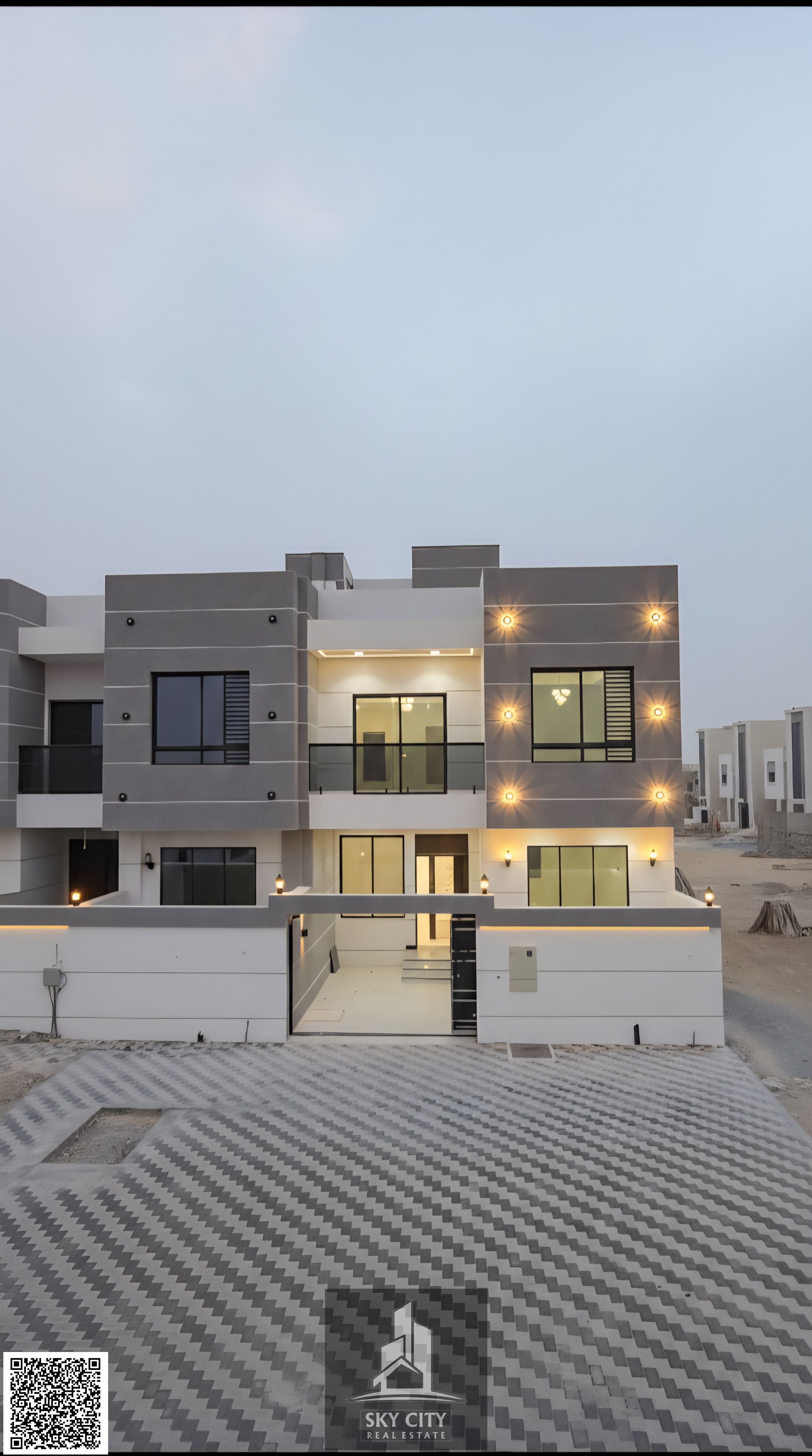 Modern villa on a main street near Emirates Bypass Road, including registration fees, 5 rooms, personal finishing, central air conditioning, freehold ownership and no annual fees.