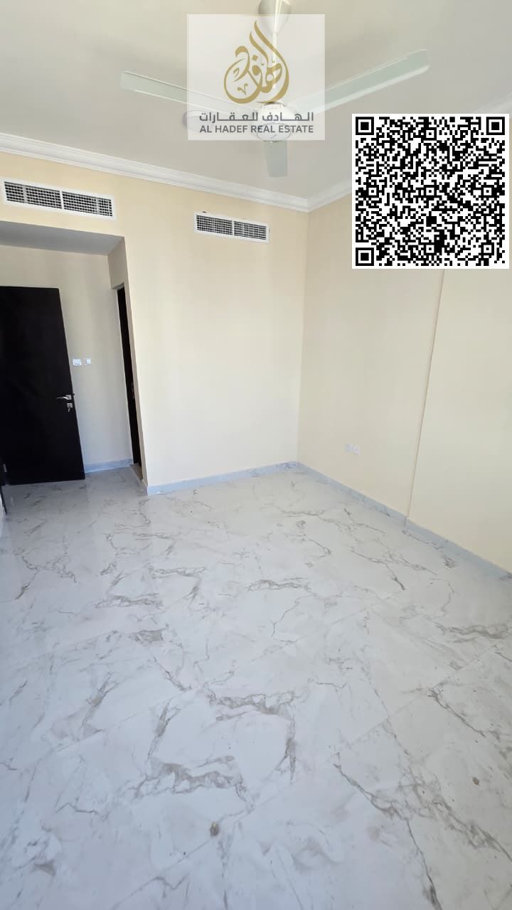For rent in Ajman, first occupancy, in Al Jurf 3 on Sheikh Mohammed Bin Zayed Road: one bedroom, living room, two bathrooms, and balcony. Rent is AED