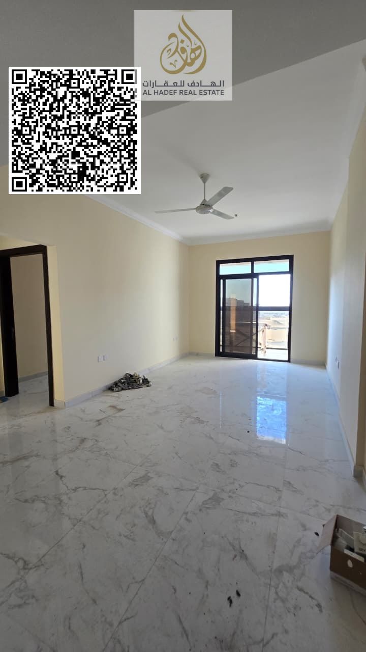 For rent in Ajman, first occupancy, in Al Jurf 3 on Sheikh Mohammed Bin Zayed Road: two bedrooms, a living room, three bathrooms, and a balcony. Rent
