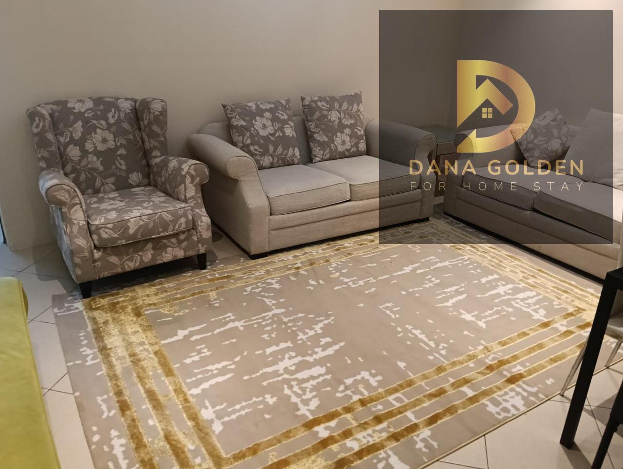 Two bedrooms and a large living room, furnished in a hotel style.