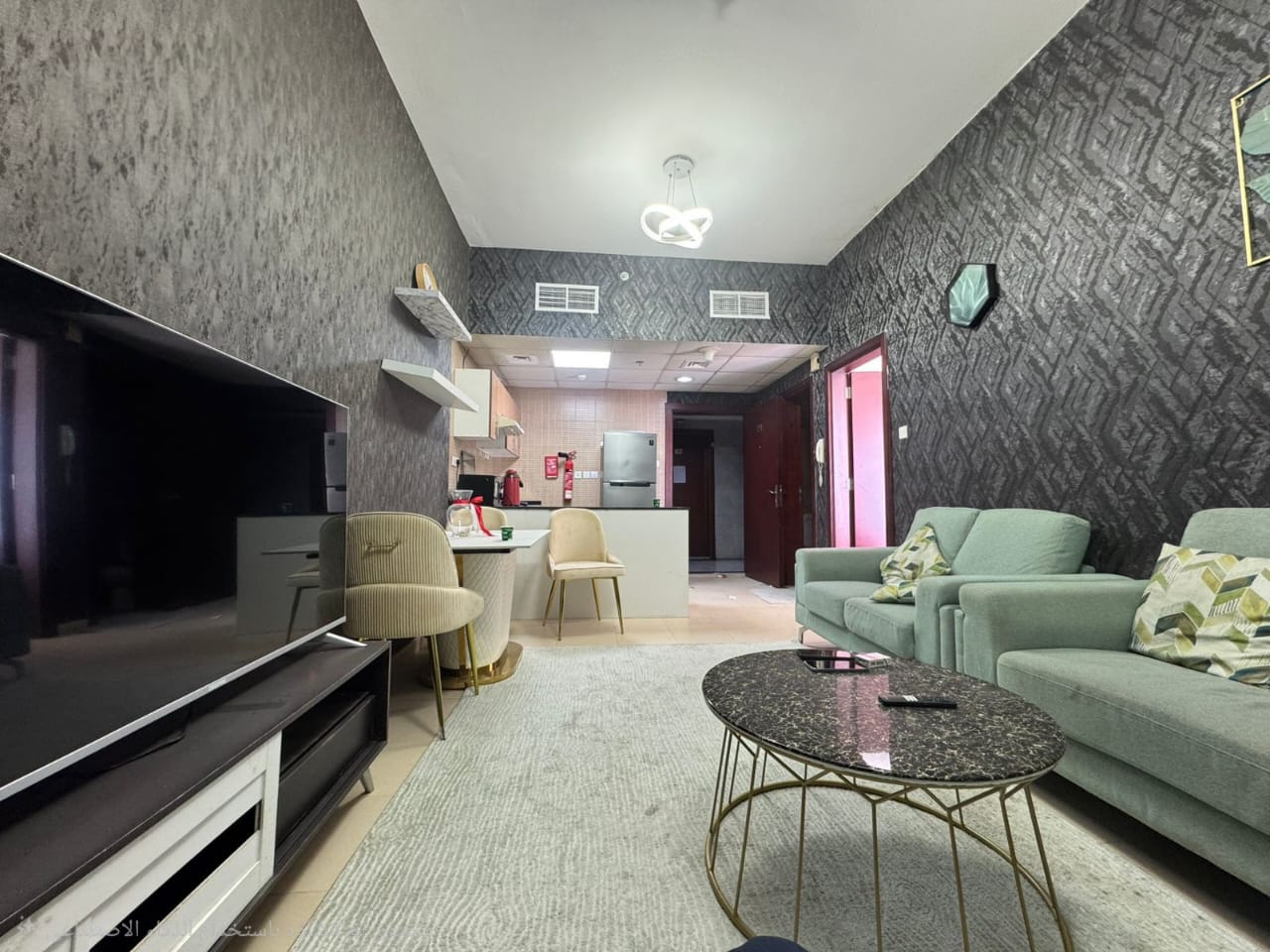 Room and living room for sale in Al Nuaimiya, City Towers, prime location on Sheikh Khalifa Street