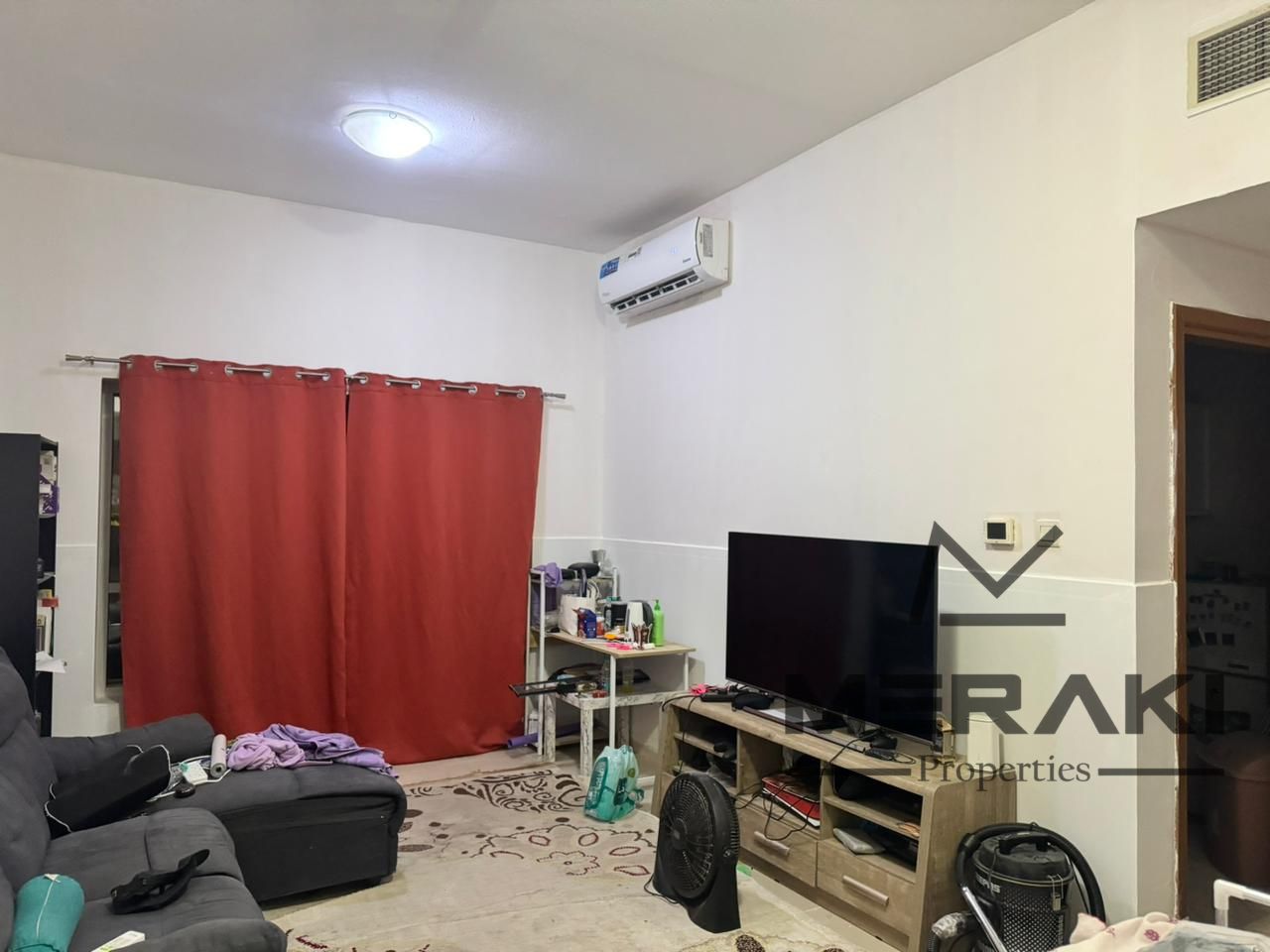 A one-bedroom apartment with a living room for cash sale at a special price, also comes with parking and a prime location in the heart of Ajman.
