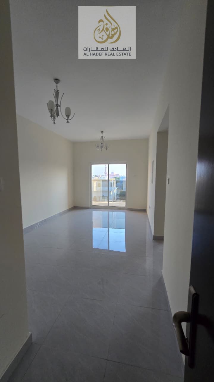 Annual rent in Ajman, Al Rawda 1 area, behind Al Hamidiya Police Station. New building, first occupancy. One bedroom and living room with balcony, ope