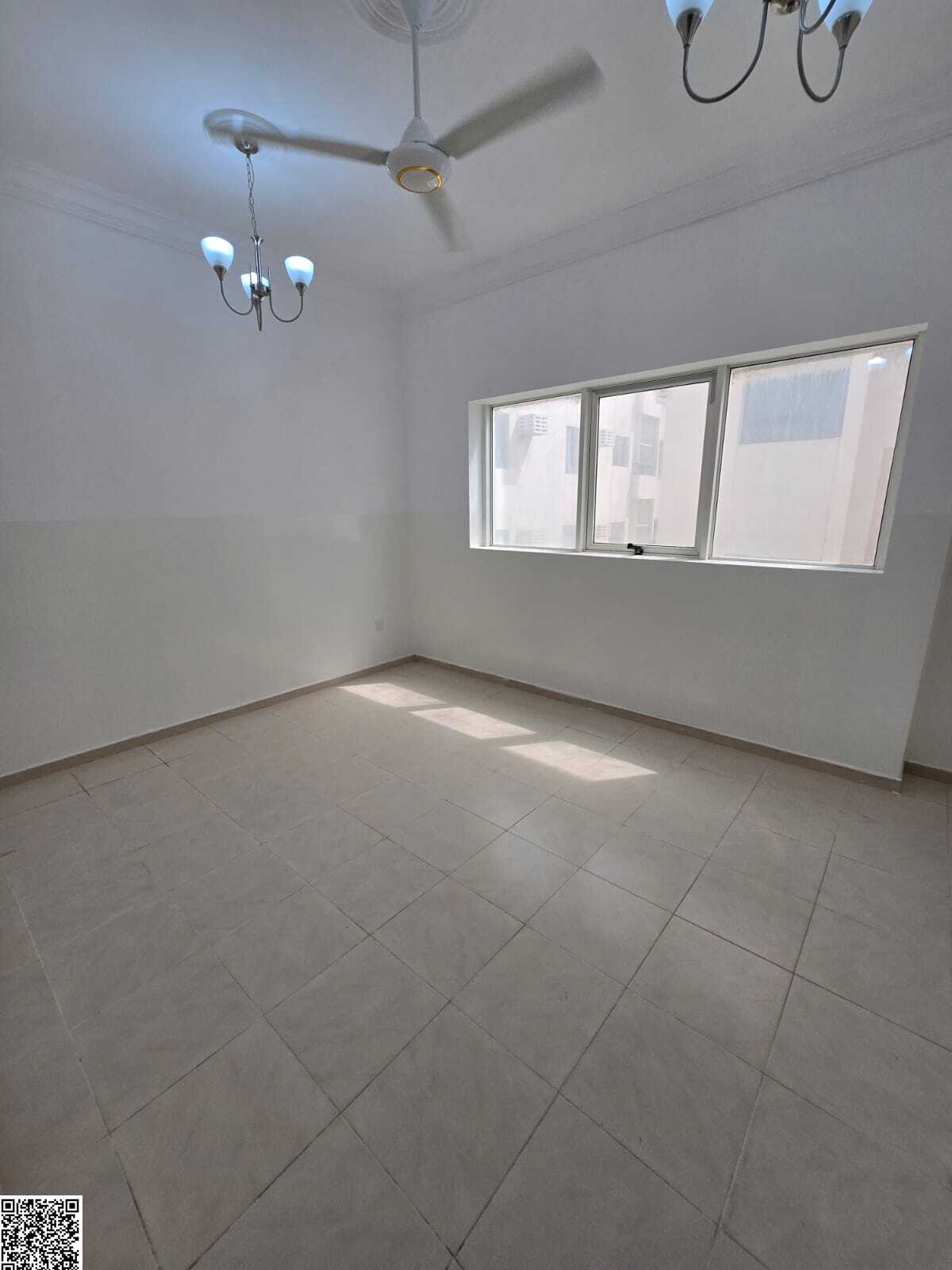Two bedrooms, a living room, two bathrooms, and a balcony in Al Nuaimiya 1, on Al Ittihad Street, next to Emirates Markets and D2D, and close to the D