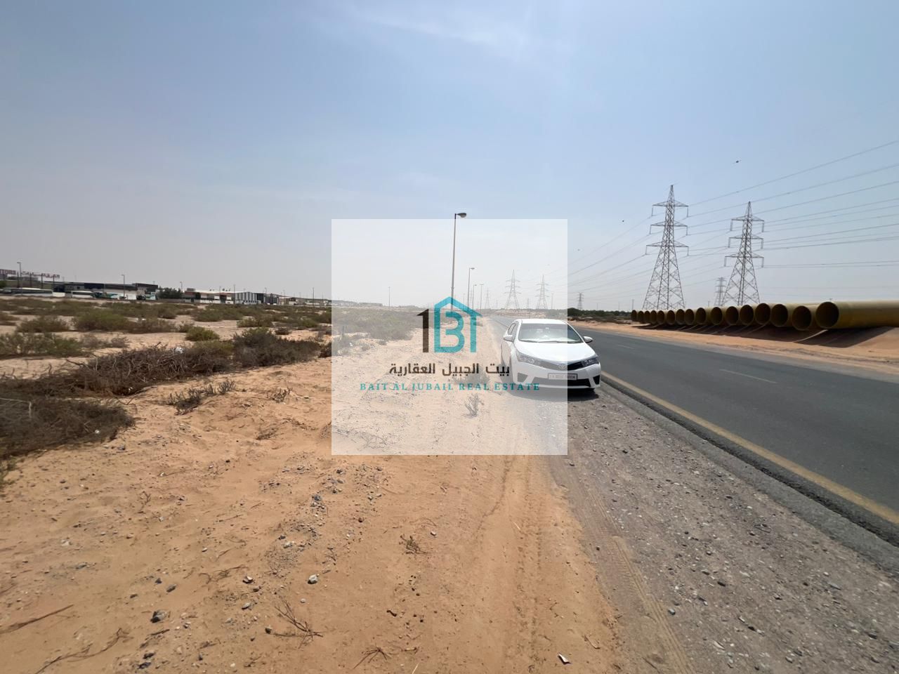 For Sale – Commercial Land in Al Hanoo (Directly on Al Emaar Road) Plot Size: 77,000 sq. ft.