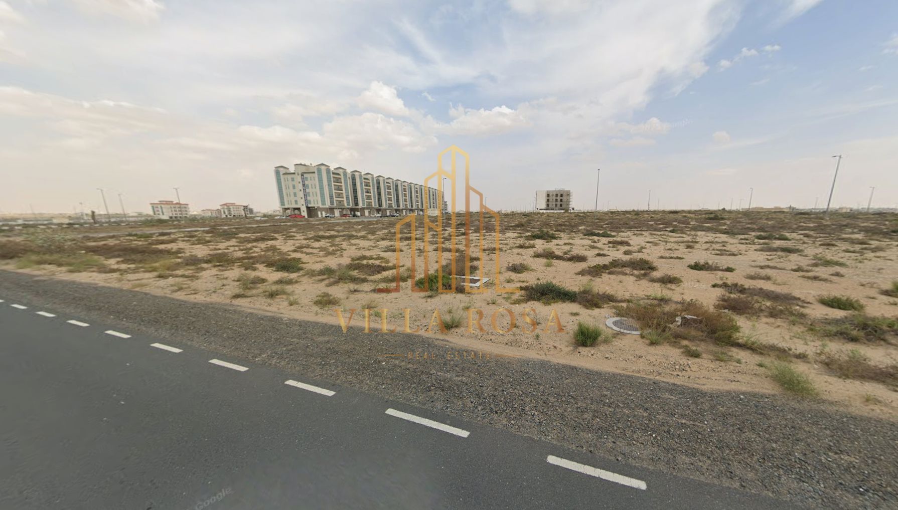 Commercial land, golden location on Emirates Road - G+4 permit - with shops on the ground floor