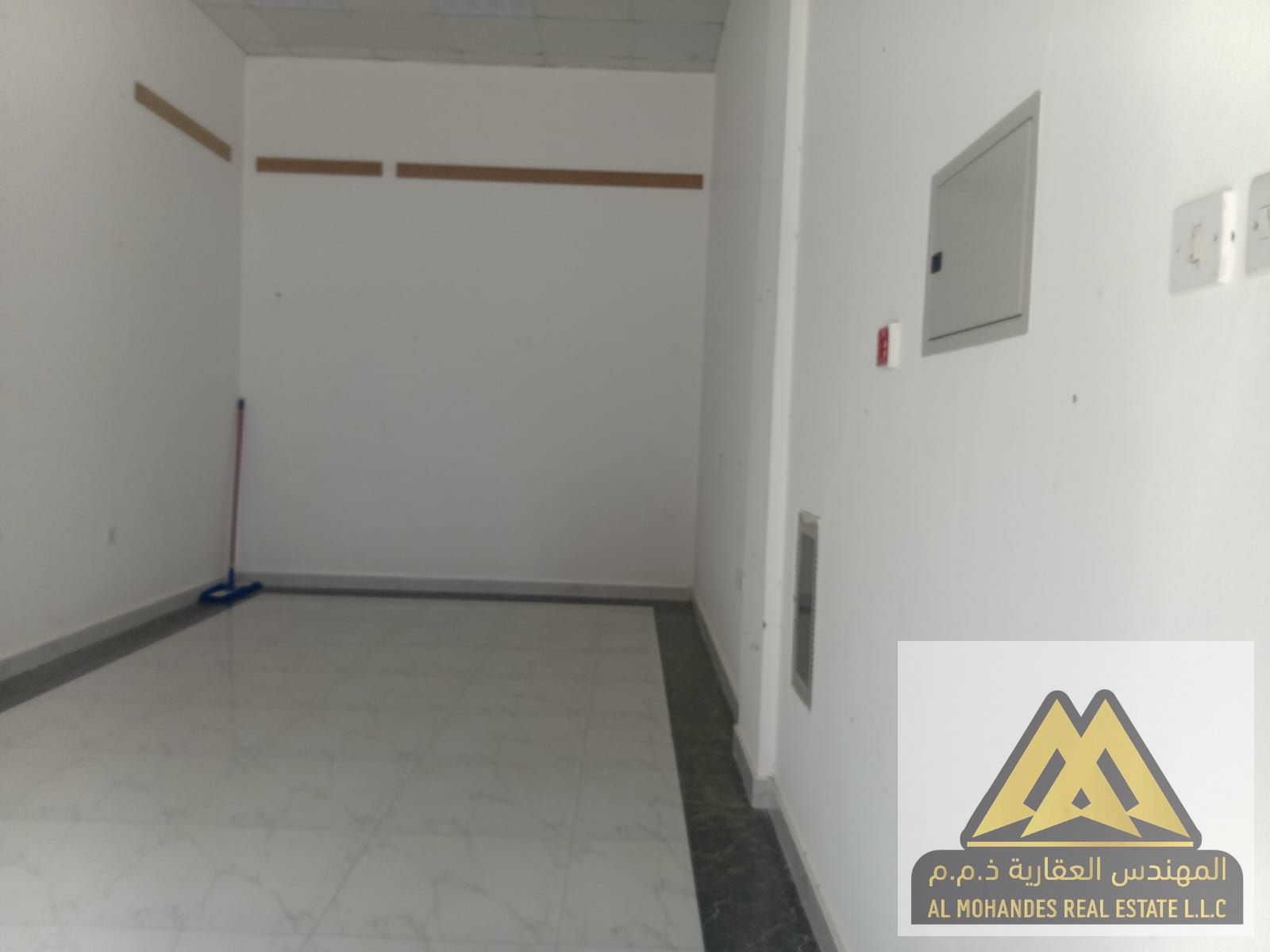Shop for rent in Al Rawda, prime location off Sheikh Ammar Street, suitable for offices or retail, 25,000 AED/year, 4 cheques, non-cashable deposit,