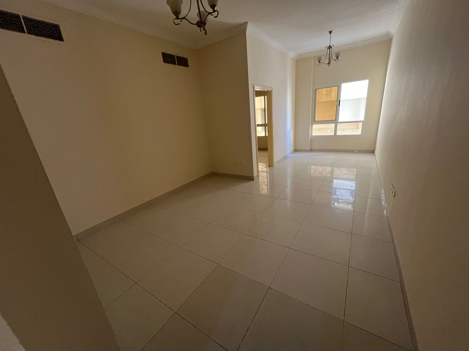 1-Bedroom apartment for rent in Al Naeemiyah 1, Ajman – master bedroom, 2 bathrooms, central AC, built-in wardrobes, family-only, AED 29,000/year.