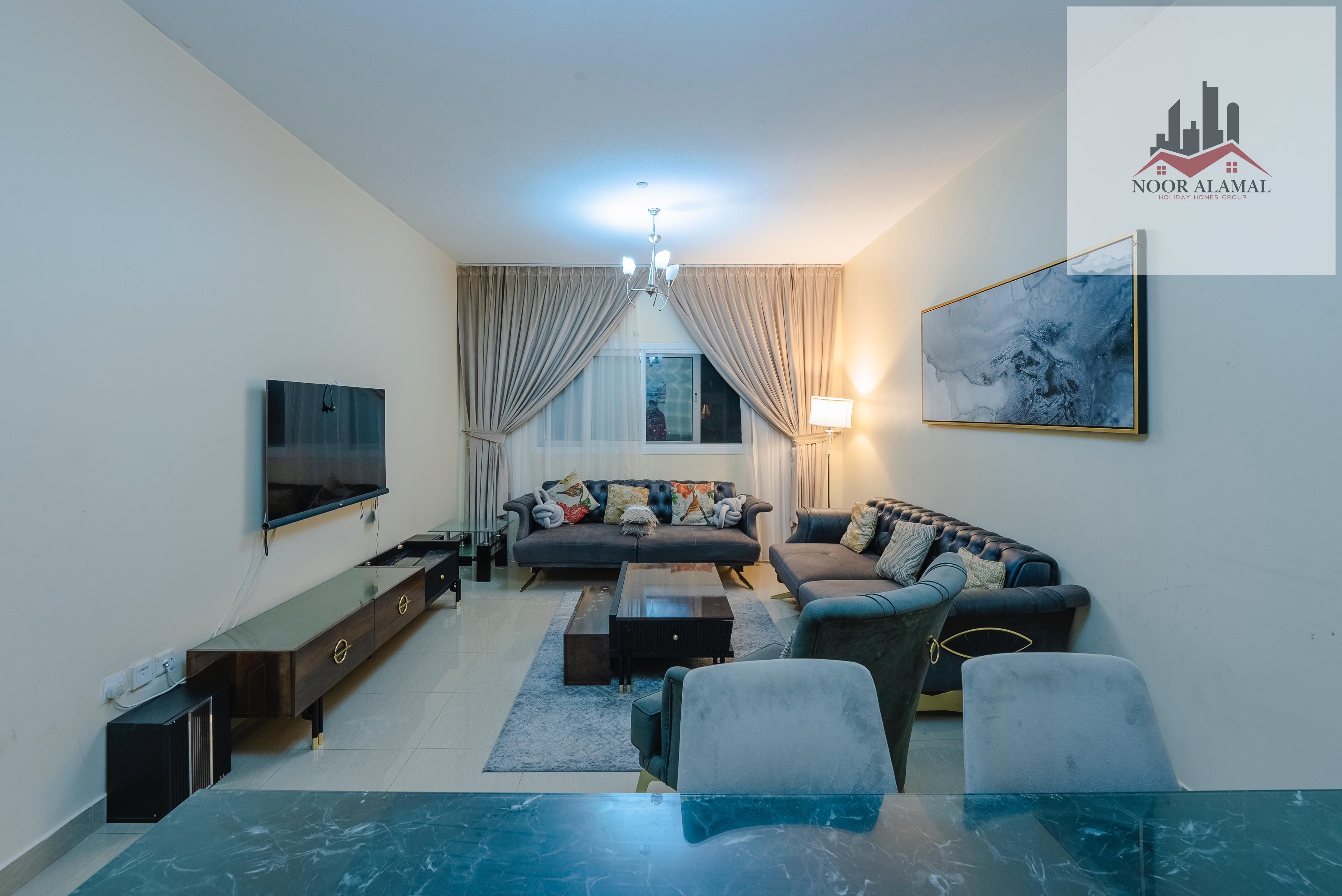 Sharjah Al Taawun, two rooms, a hall, a kitchen, two bathrooms, and a balcony. The price is 5800, including internet, parking, and a gym.
