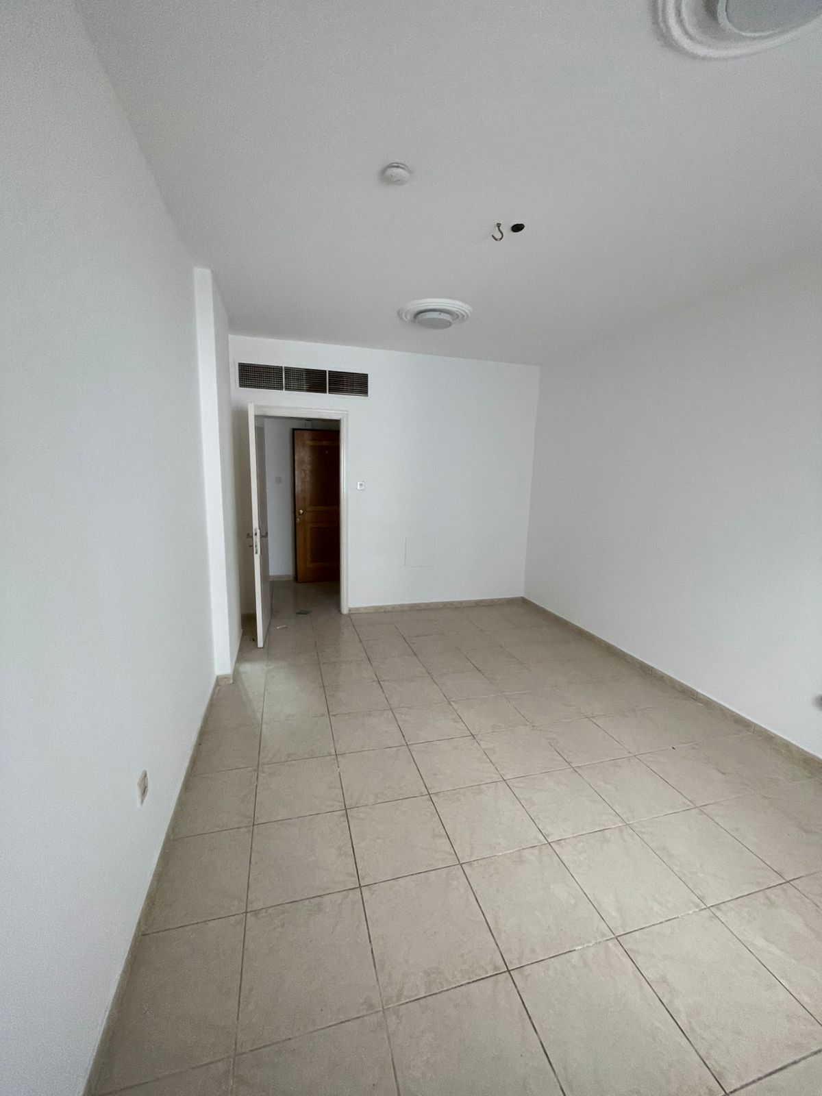 For annual rent in Sharjah, specifically in the Al Qasimia area: one bedroom, a living room, a bathroom, and a balcony. Great location close to all se