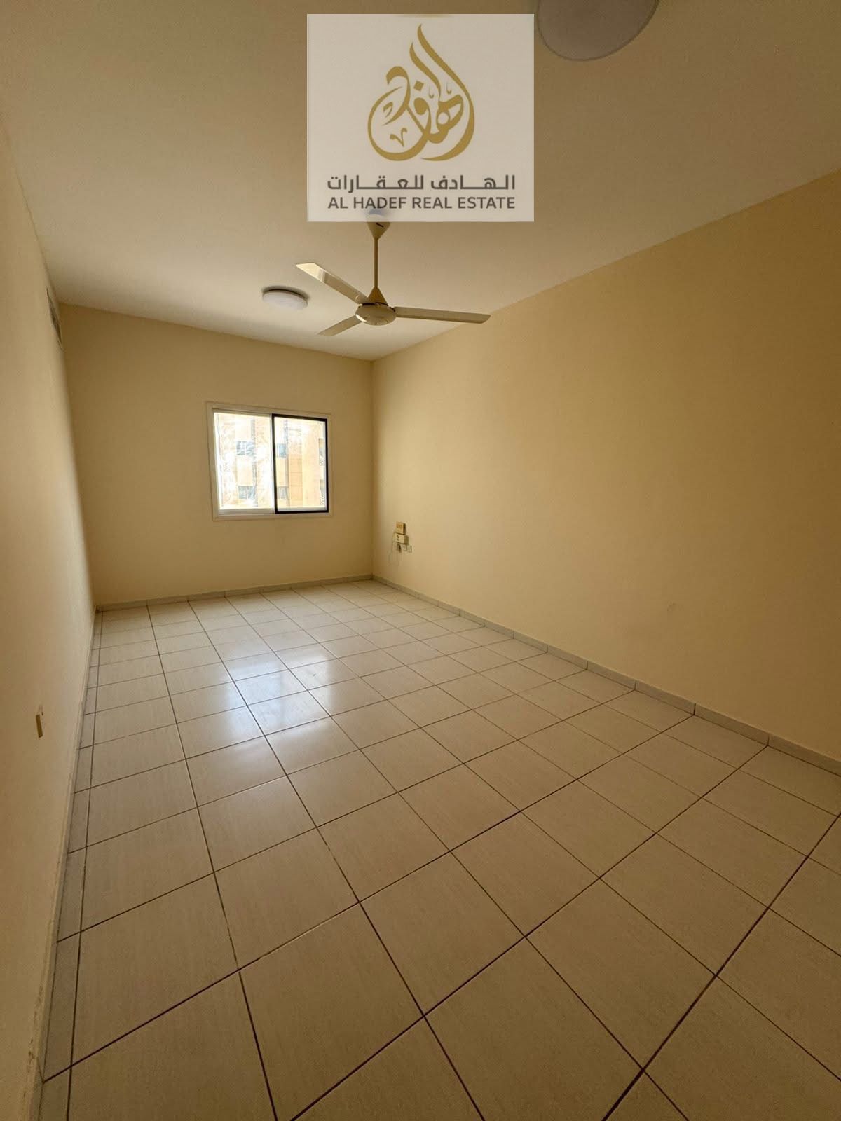 Annual rent in Ajman, Al Nuaimiya 2 area, next to Istanbul Market, Lulu Gulf, and Al Safar Mall. Two bedrooms, separate living room, central air condi