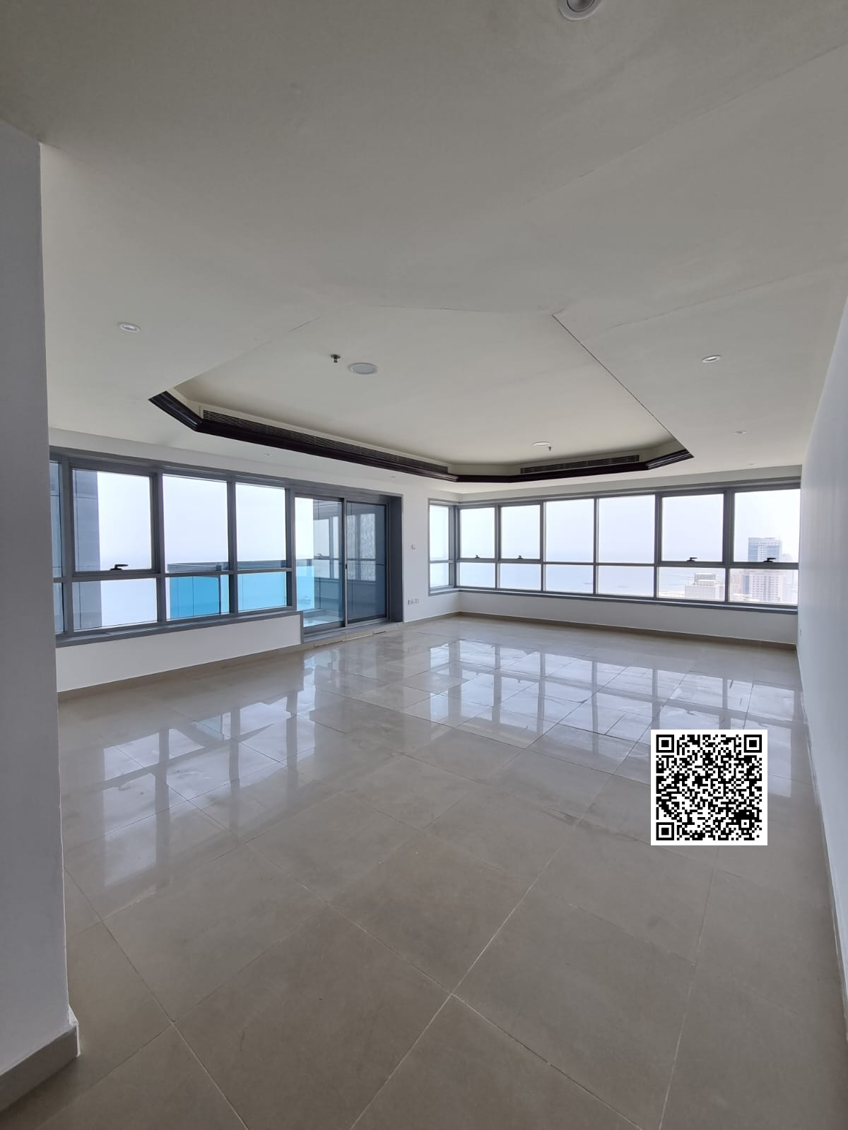 Panoramic corner view of the sea and the city from a high floor