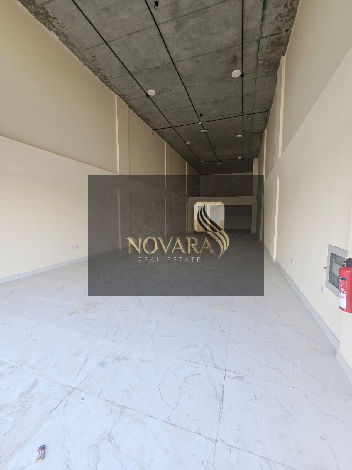 Shop for rent in Al Jurf 2 near Ajman Court, 2,000 sq. ft on main road, ideal for retail or café, AED 230,000