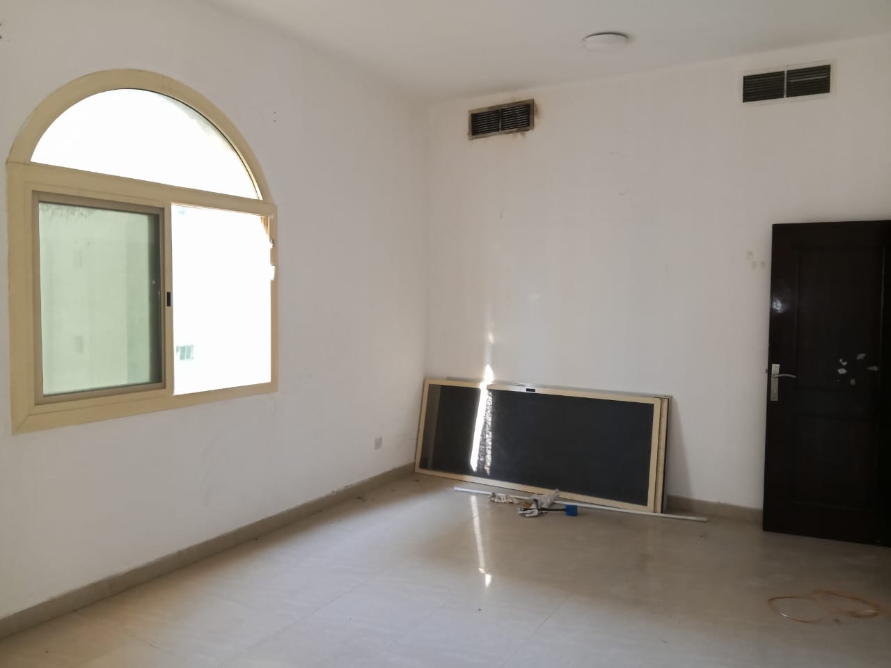 For annual rent in Sharjah, specifically in the Al Qasimia area: two bedrooms, a living room, central air conditioning, and an excellent size.