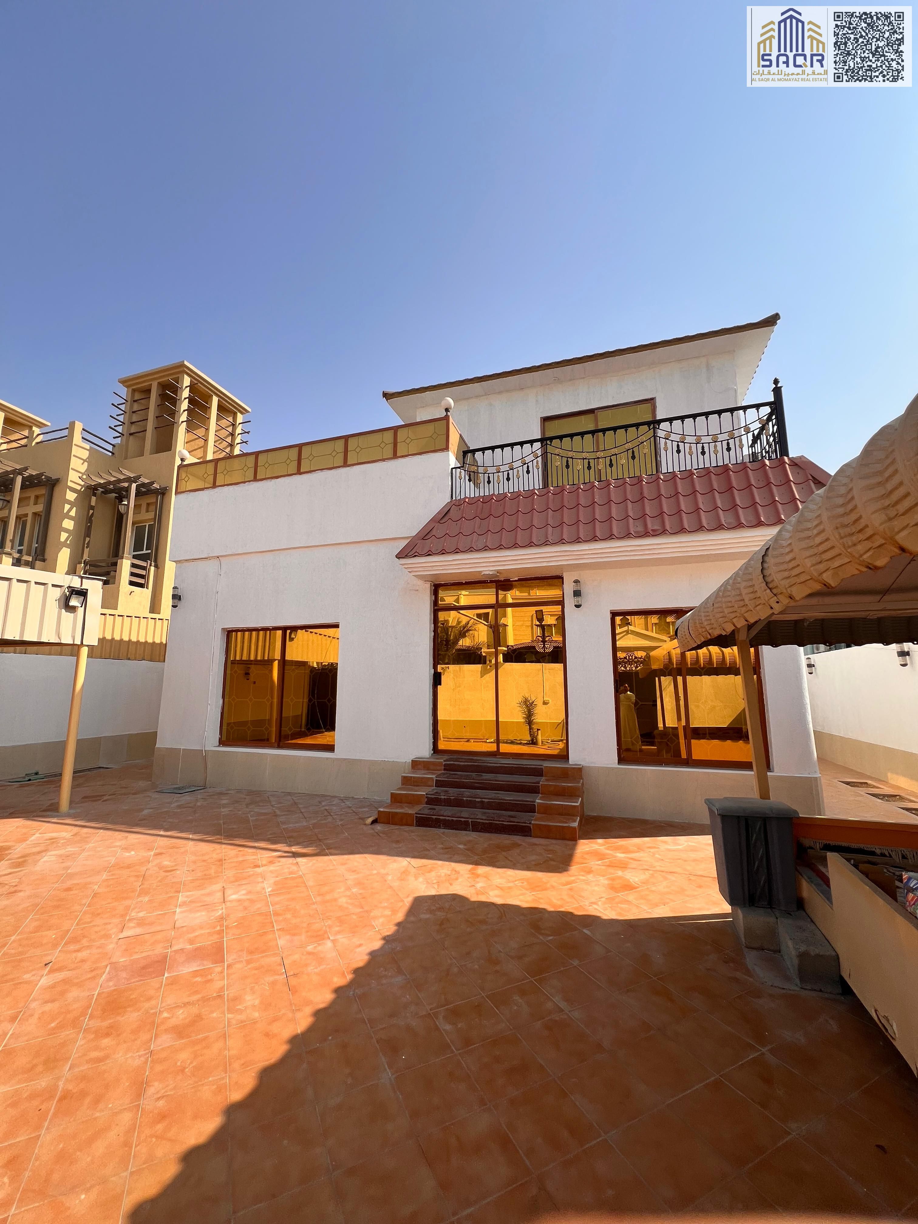 Villa for rent in Al Rawda 3 area. It consists of 6 bedrooms, a majlis (formal sitting room), a living room, an outdoor seating area, an indoor carpor