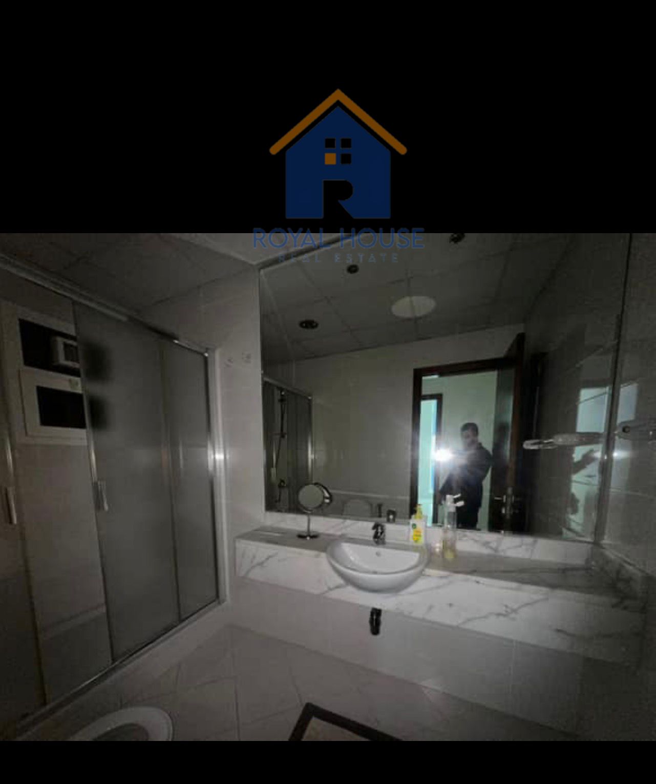 Two bedrooms and a living room in a very upscale tower