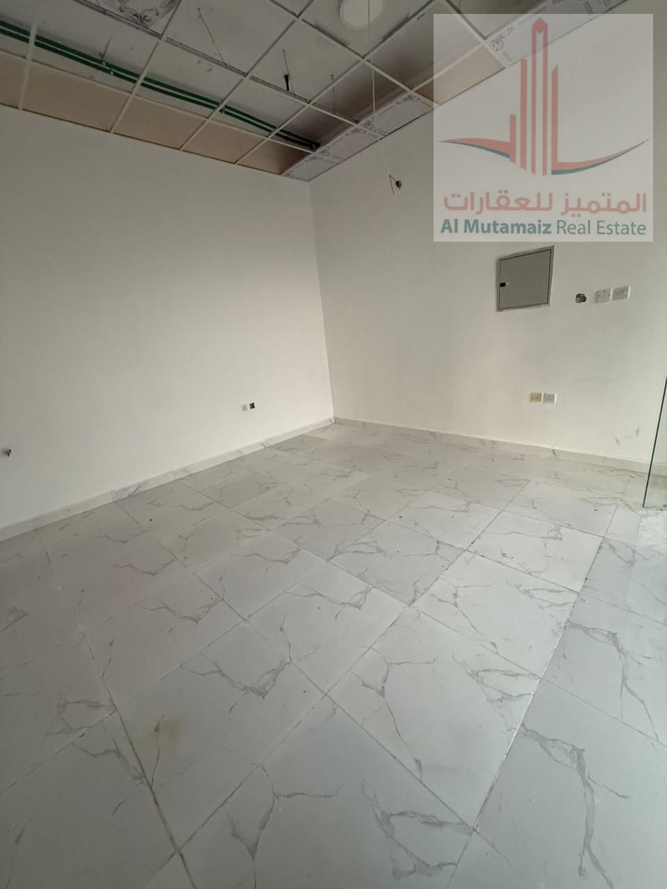 Shop for annual rent in Al Jurf Industrial City, excellent location on a main street
