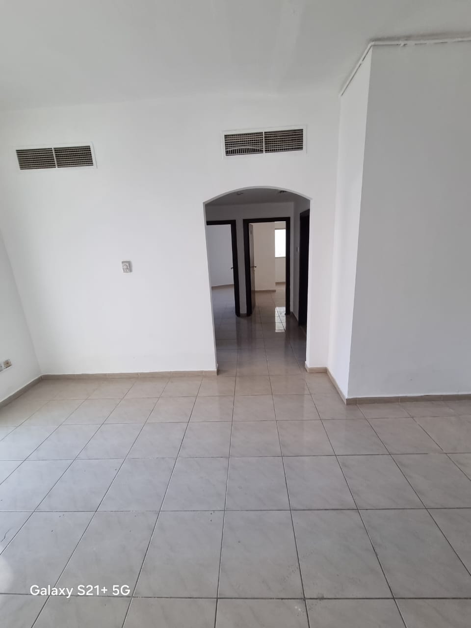 For annual rent in Sharjah, specifically in the Al Qasimia area: two bedrooms, a living room, two bathrooms, a balcony, and central air conditioning.