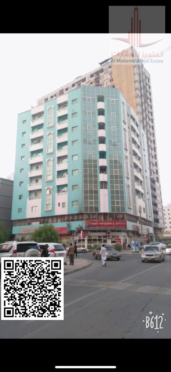 Two-bedroom apartment with a living room, two bathrooms, and a balcony, near the Egyptian restaurant.