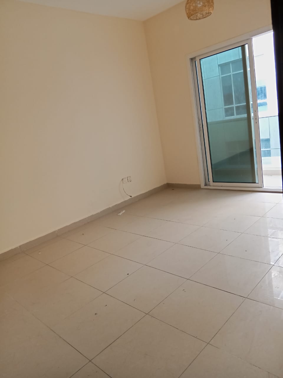 For annual rent in Sharjah, specifically in the Al Taawun area: two bedrooms, a living room, two bathrooms, a balcony, central air conditioning, and a