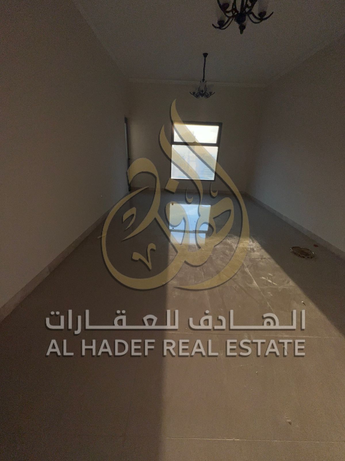 For annual rent in Sharjah, Al Nahda area: one bedroom and a living room, free air conditioning, and free parking on Al Ittihad Street, behind Sahara
