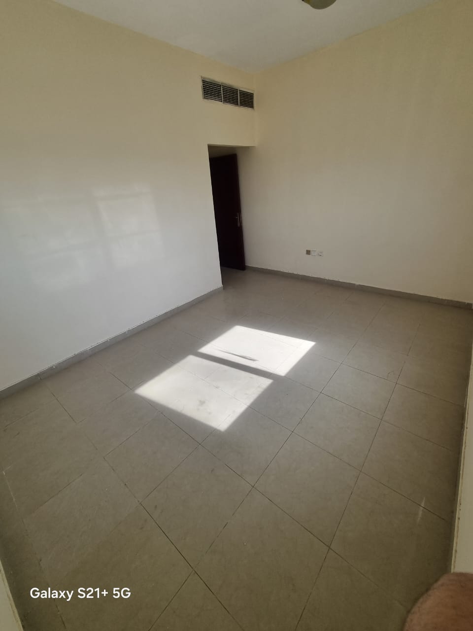 For annual rent in Sharjah, specifically in the Muwaileh area: a one-bedroom apartment with a living room, two bathrooms, a balcony, and central air c