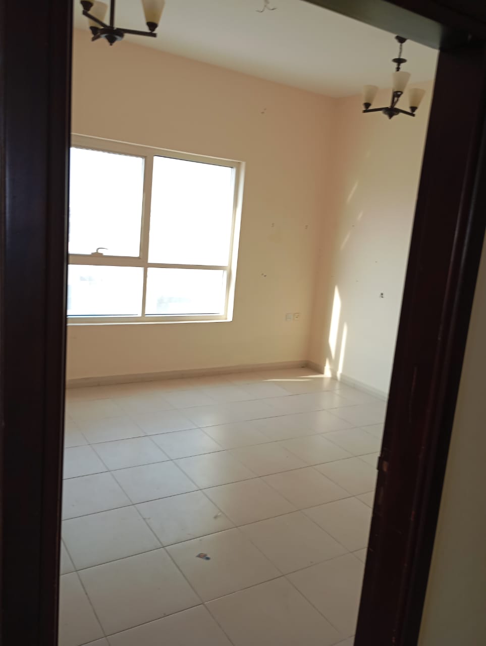 For annual rent in Sharjah, specifically in the Muwaileh area: two bedrooms, a living room, two bathrooms, central air conditioning, and an excellent