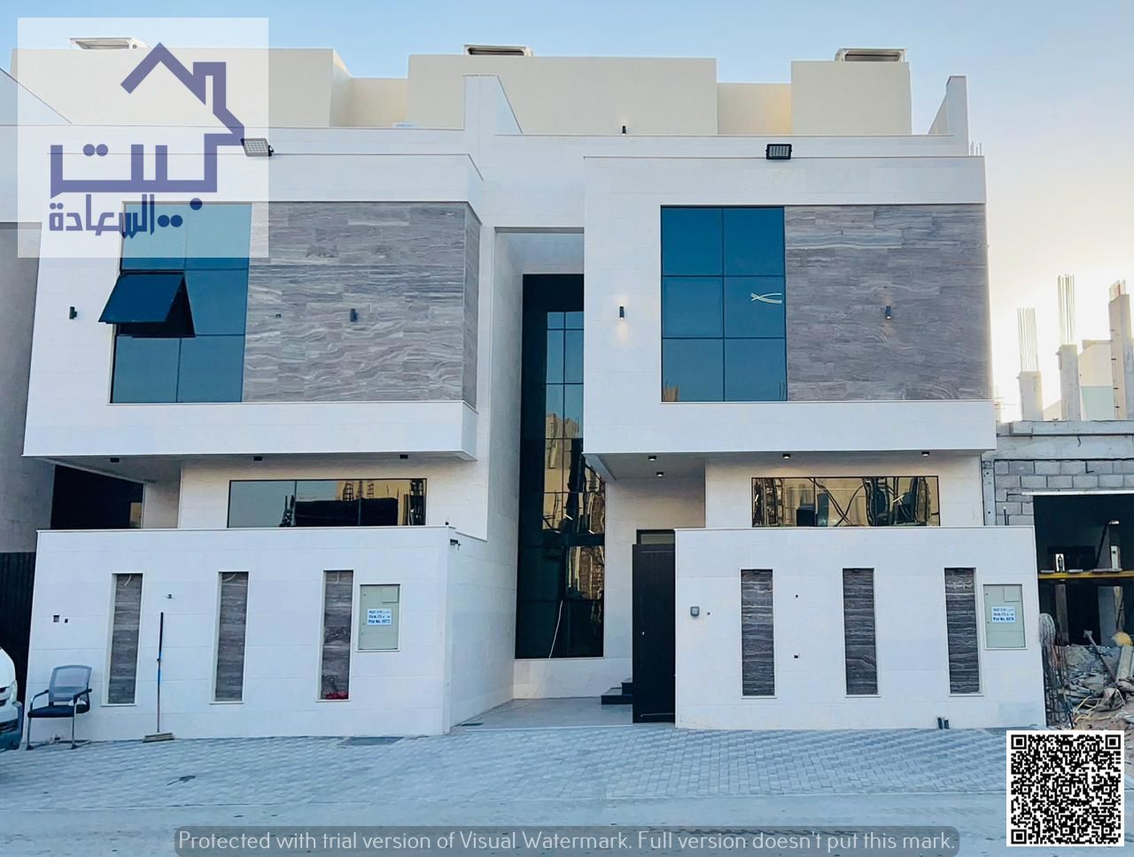 For Sale: Stone façade townhouse in Al Helio 1, Ajman. Two floors + roof, fees included. Freehold for life, no annual fees, prime location.