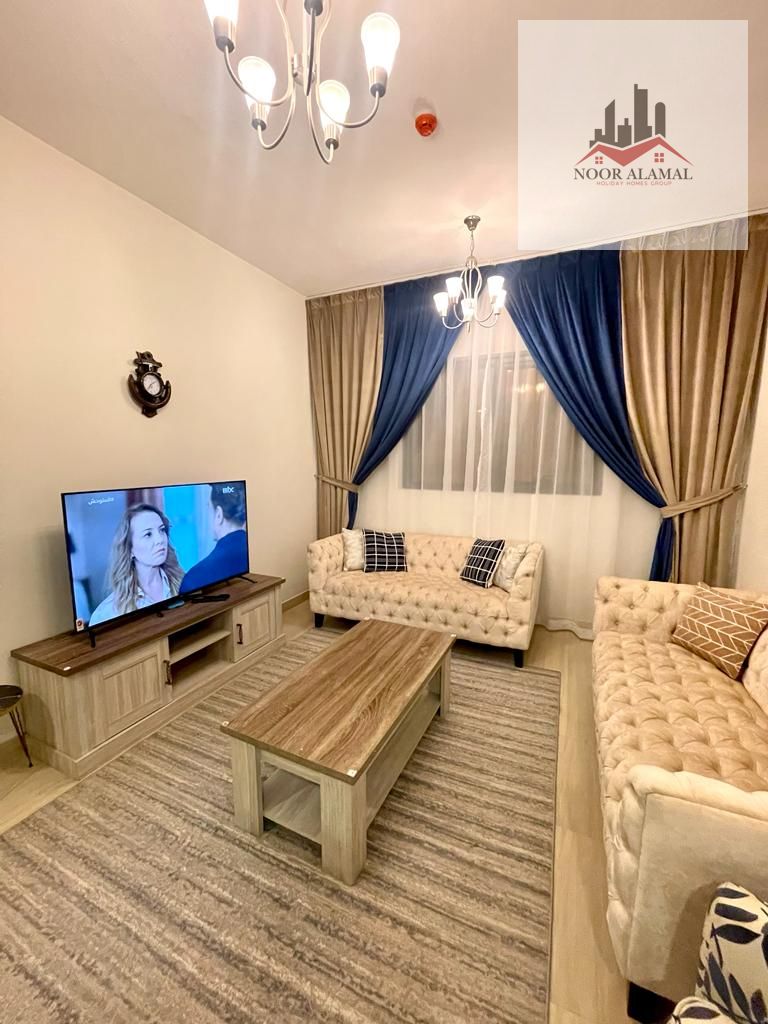 Sharjah, Al Taawun area: One bedroom, living room, kitchen, and two bathrooms. Second occupant. New building. All new furnishings. Super deluxe. 5500