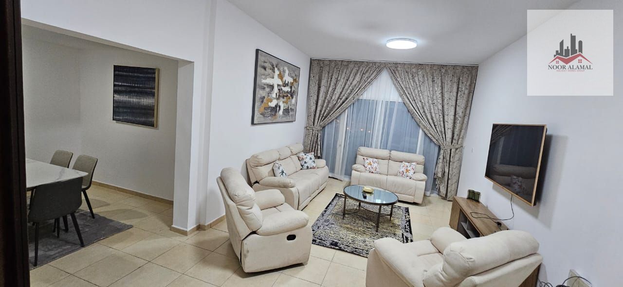 Sharjah Al Khan, fully furnished apartment with hotel furniture, three rooms, a hall, a kitchen, three bathrooms, a balcony with an open view of the l