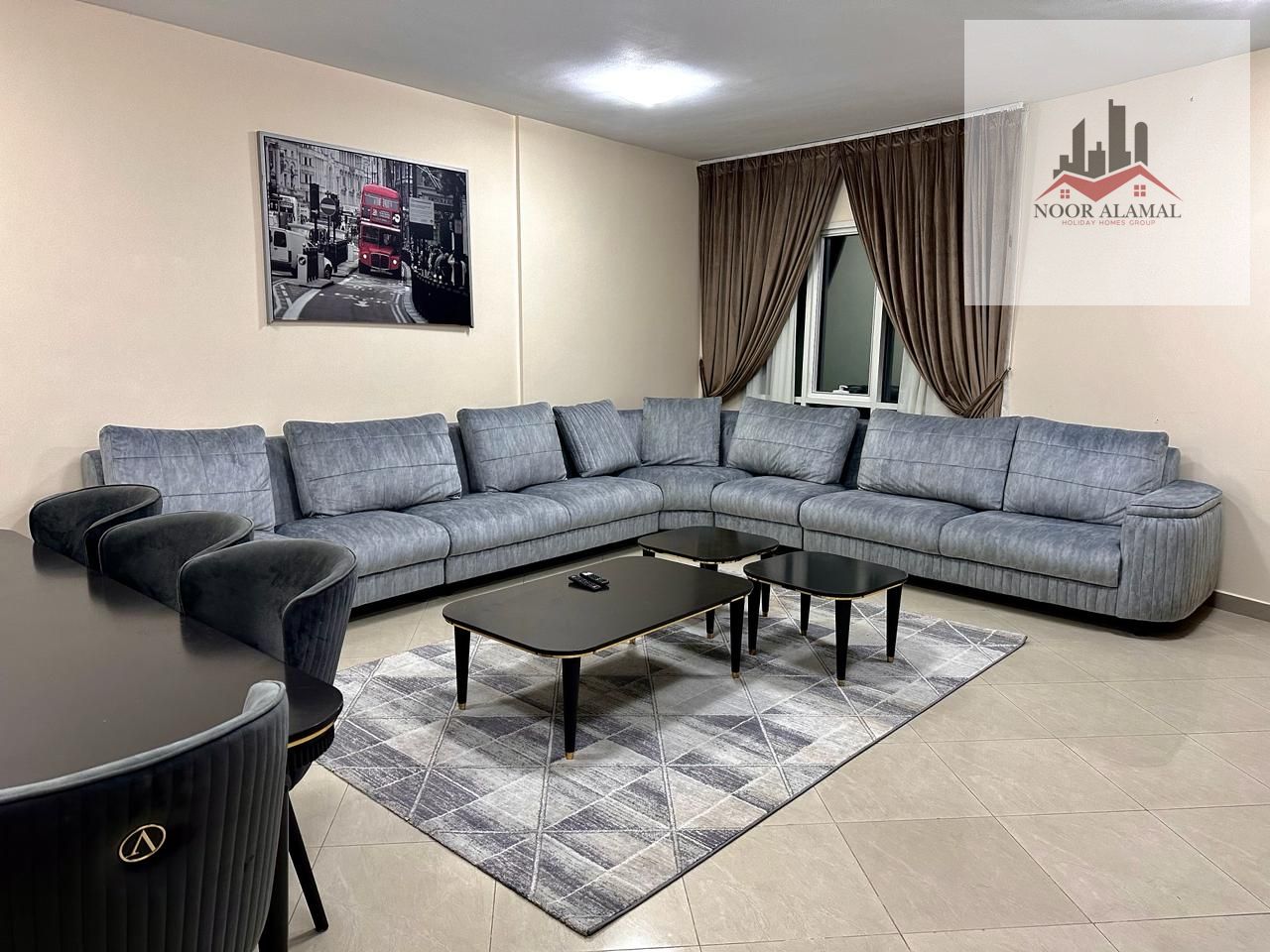 Sharjah Al Taawun, second floor, furnished, hotel-style, two rooms, a hall, a kitchen, two bathrooms, and a balcony. . . on the main street. The price i